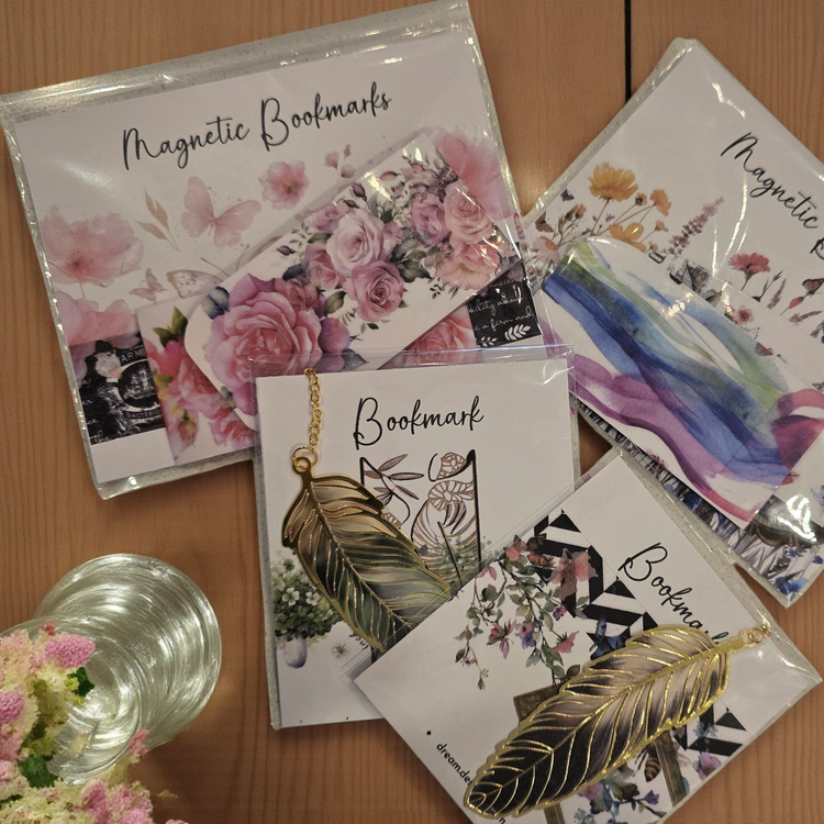 collection of dream.design.bloom discbound planner bookmarks including gold butterfly, gold feather, and magnetic styles designed to mark pages beautifully and add boutique elegance to your planner
