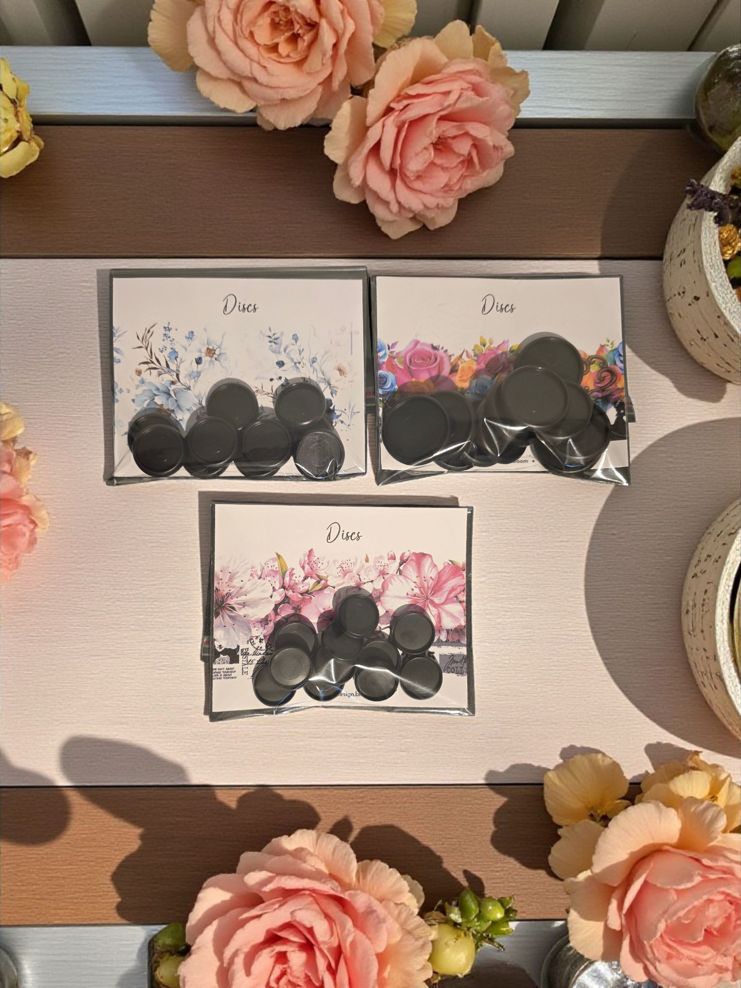 Black planner discs by dream.design.bloom in packaging, matte black discbound planner accessories designed for Bloom Size planners