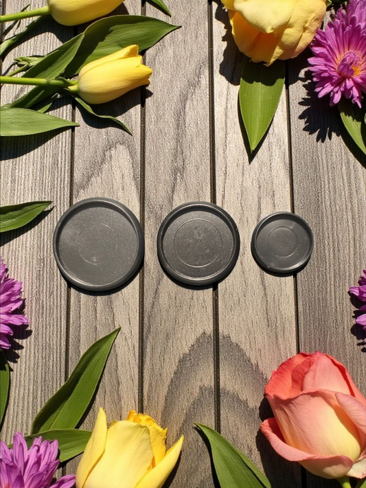 Black planner discs by dream.design.bloom displayed side by side to show size options, boutique discbound planner accessories for strength and style