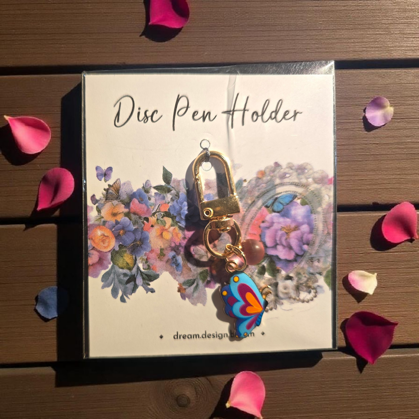 Celestial Blooms short disc key charm by dream.design.bloom, colourful rainbow discbound planner accessory with unique butterfly charm