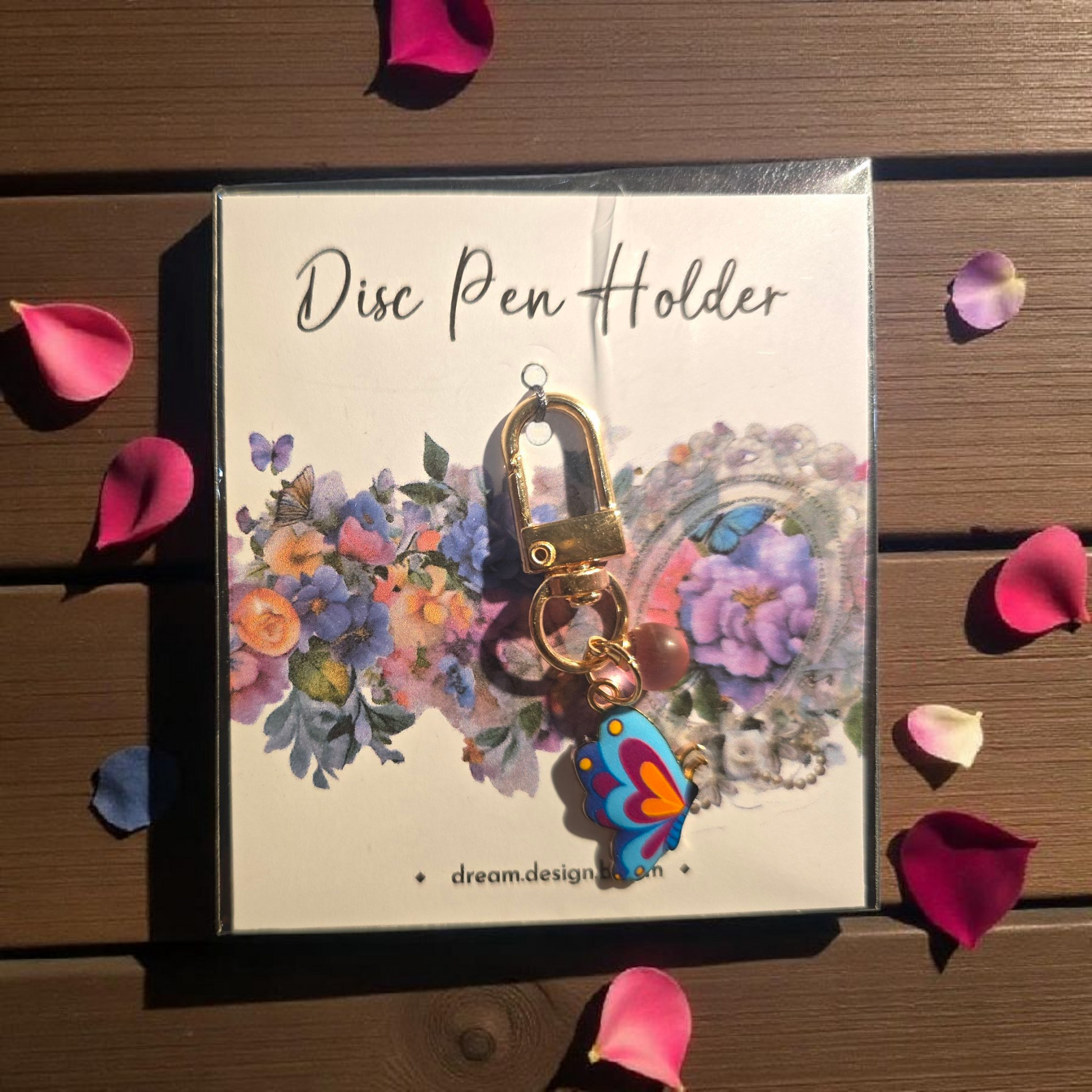 Celestial Blooms short disc key charm by dream.design.bloom, colourful rainbow discbound planner accessory with unique butterfly charm