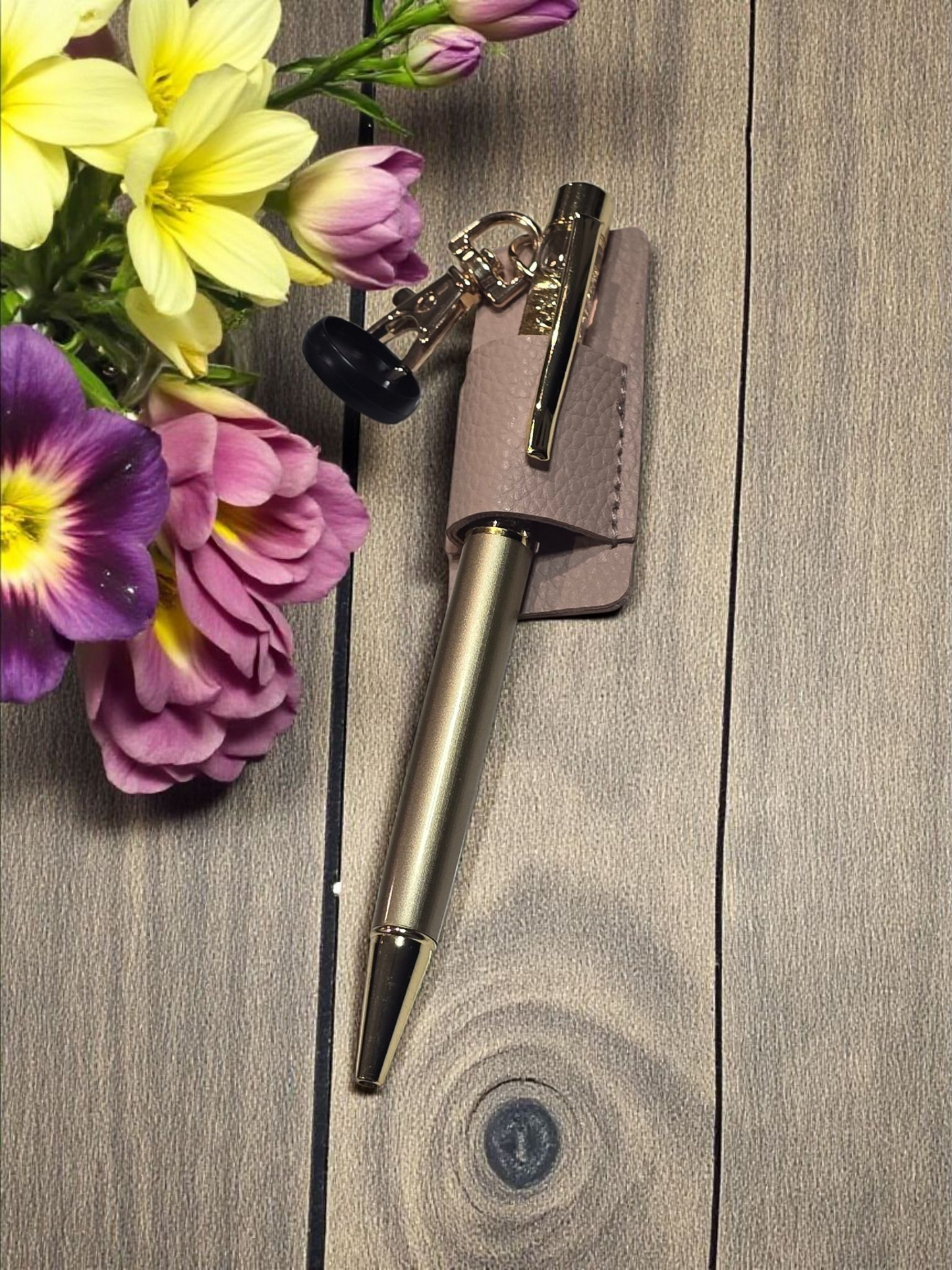 Disc Pen Holder by dream.design.bloom in pink, shown holding a pen, boutique discbound planner accessory for elegant organisation