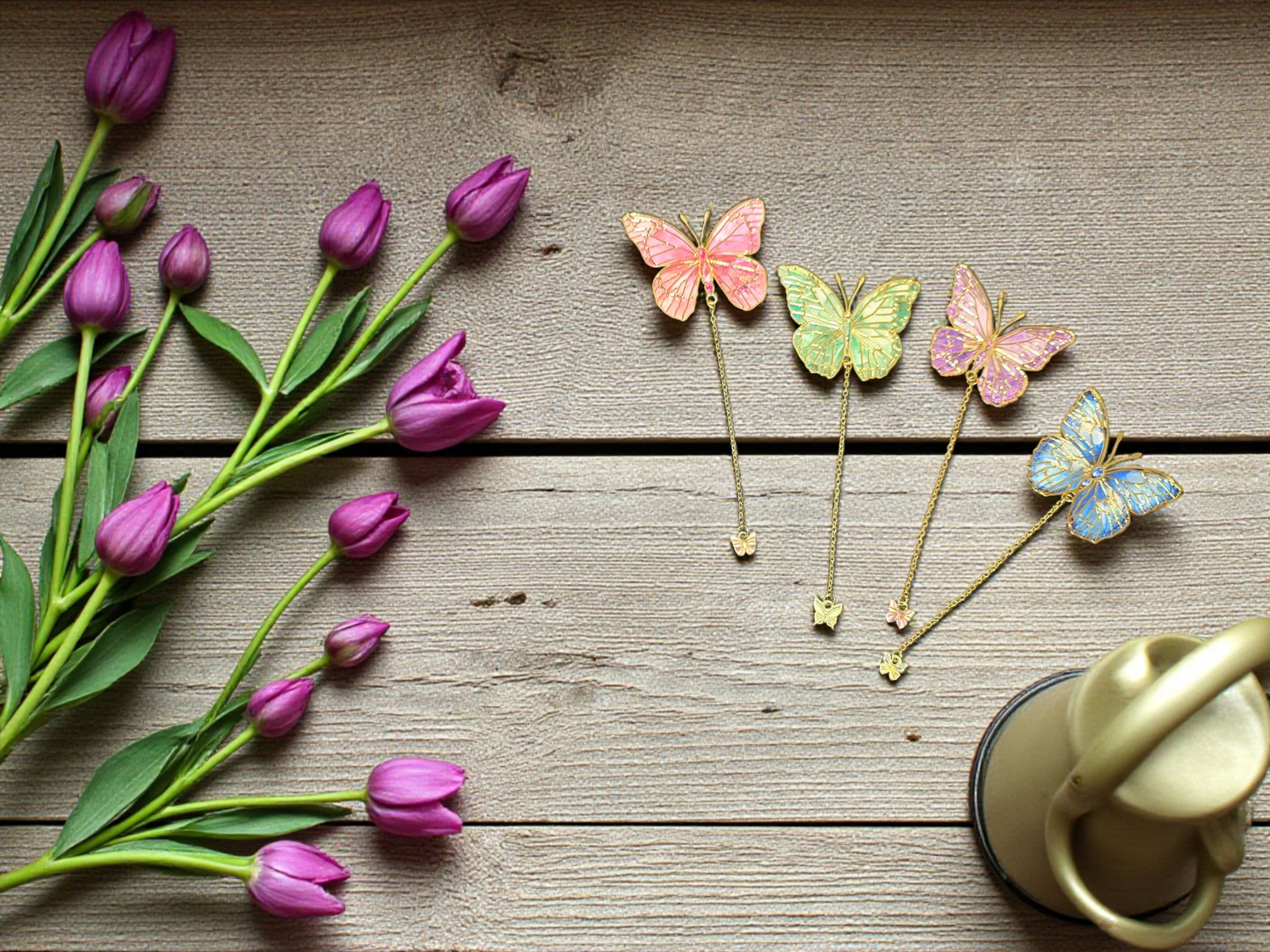 Flatlay of gold butterfly planner bookmarks by dream.design.bloom featuring Whisper Dreams, Azure Blooms, Arbor Designs and Celestial Blooms colour palettes