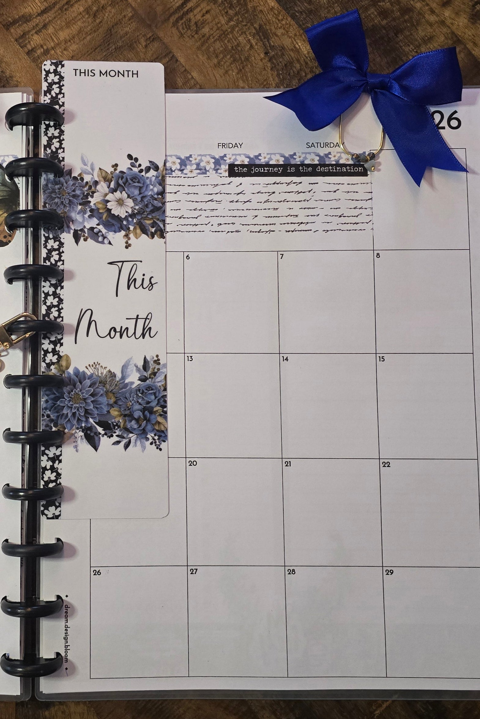 Large Paperclip with Bow in Azure Blooms palette by dream.design.bloom displayed marking a page in discbound planner, boutique accessory combining beauty and function