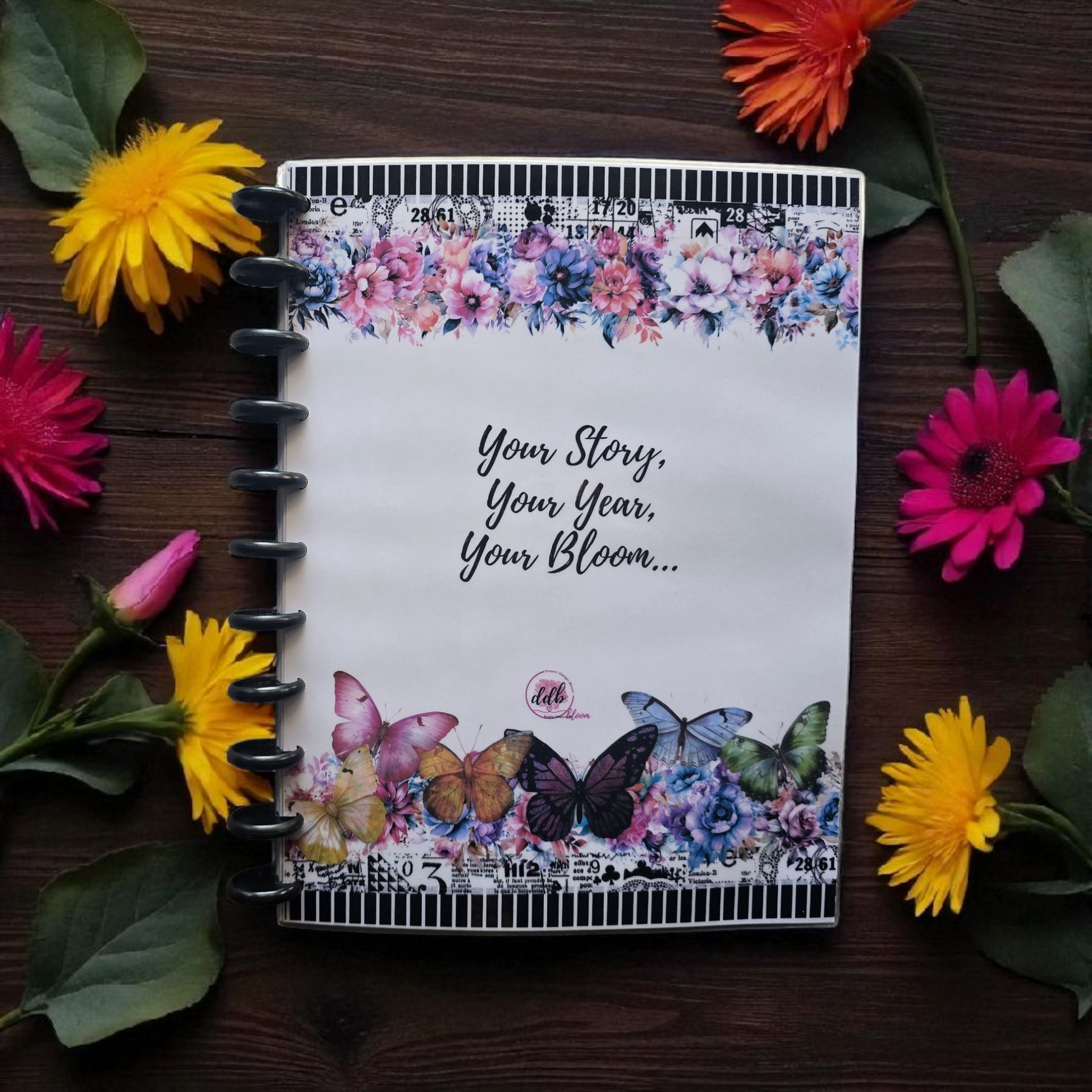 front cover of Celestial Blooms 2026 discbound monthly dated planner in rainbow inspired palette