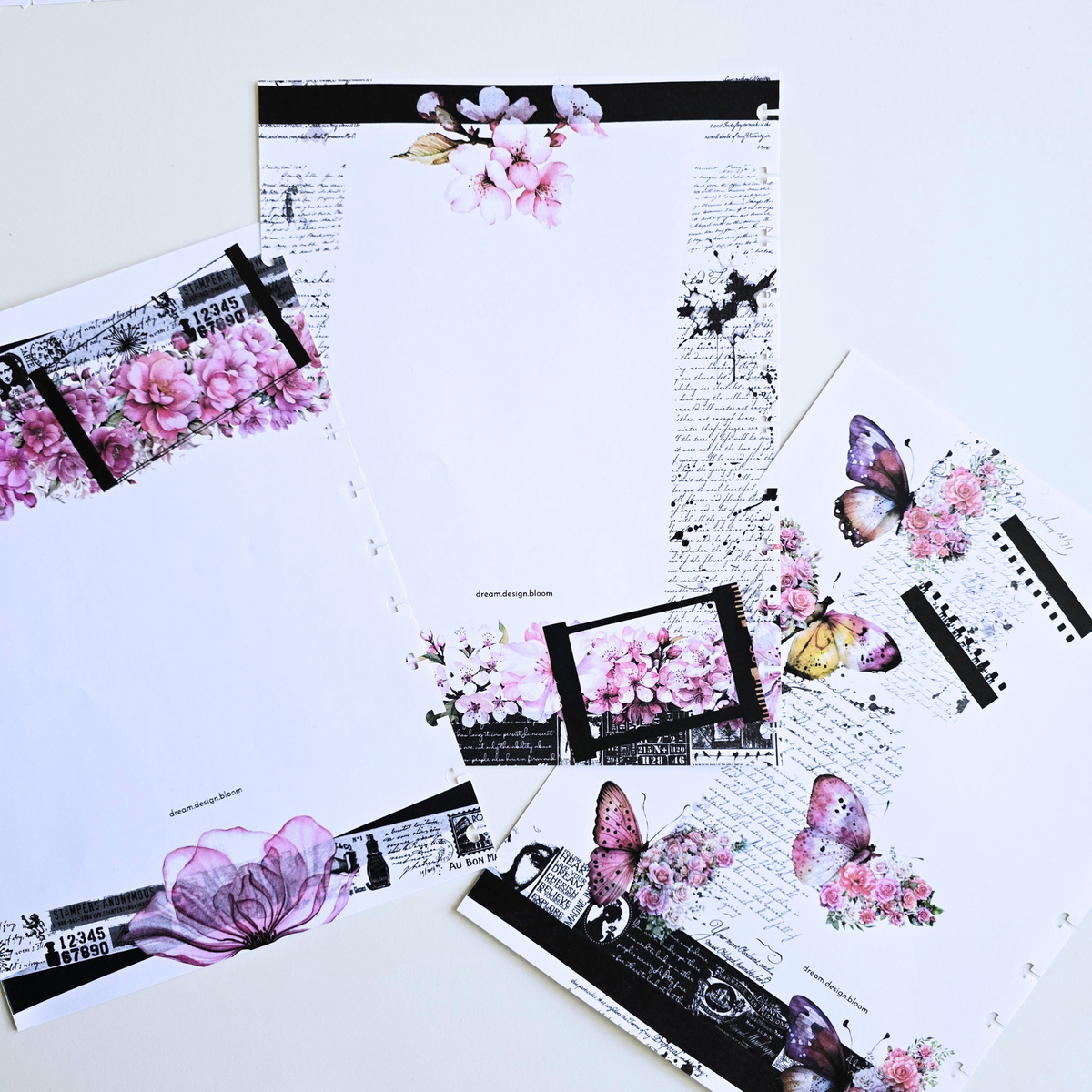 A flat lay of discbound-blank-inserts featuring pink flowers, butterflies, script text, and black collage borders on a white background.