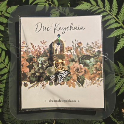 Arbor Designs short disc key charm by dream.design.bloom, natural green discbound planner accessory with charm and ribbon details