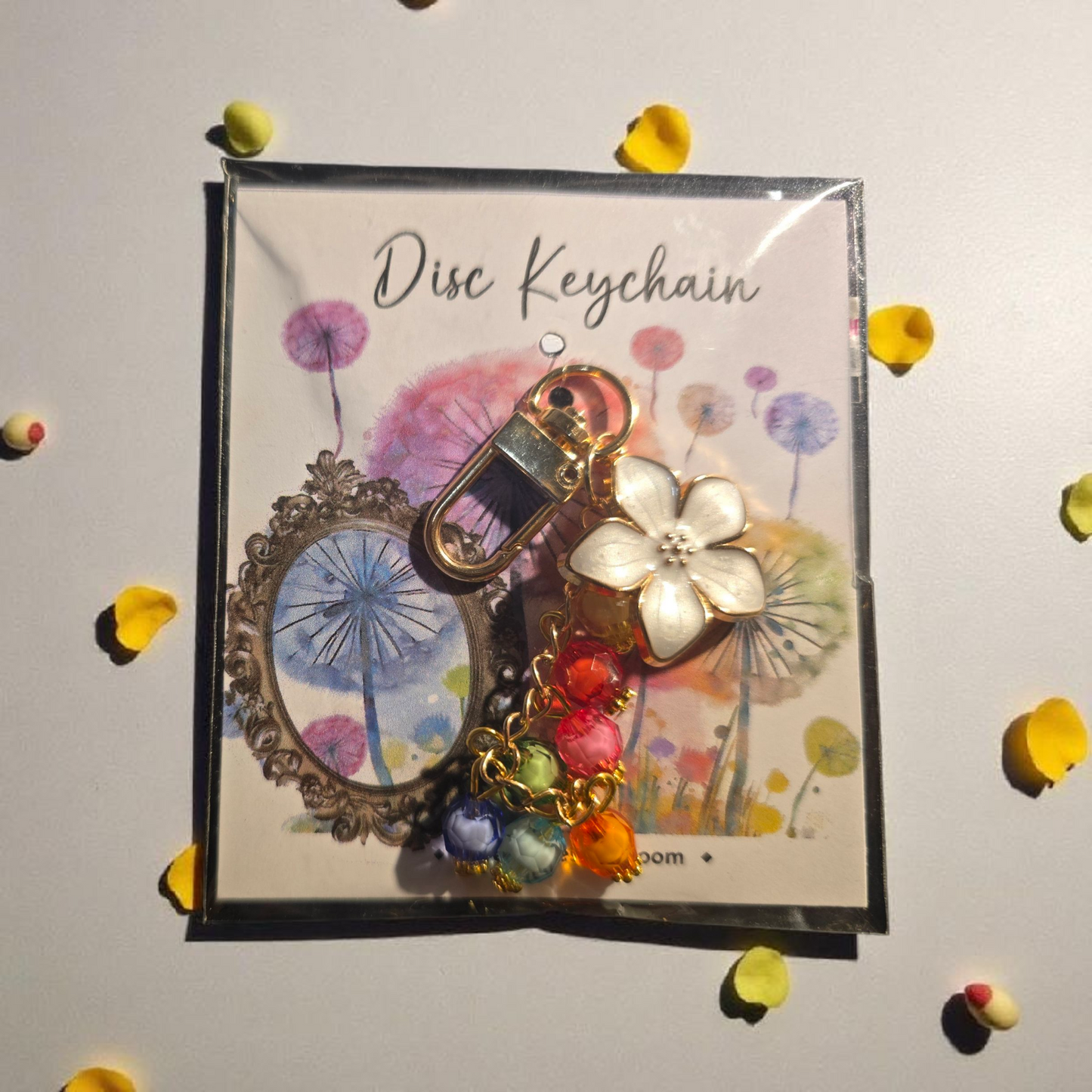Celestial Blooms long disc key charm by dream.design.bloom, rainbow discbound planner accessory with hand-assembled boutique details