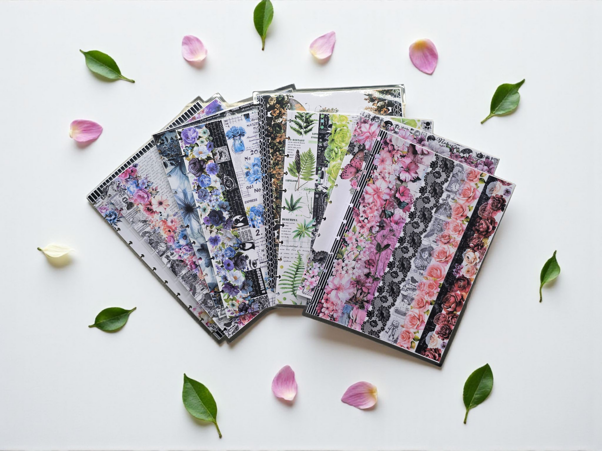 flatlay of discbound planner covers collection by dream.design.bloom featuring Whisper Dreams, Azure Blooms, Arbor Designs and Celestial Blooms