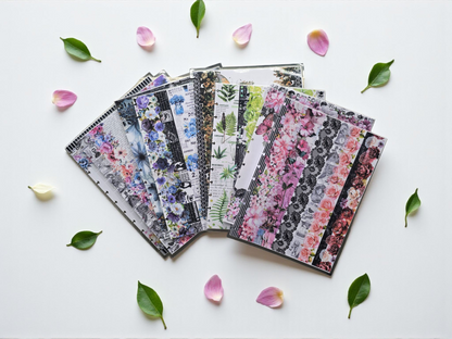 flatlay of discbound planner covers collection by dream.design.bloom featuring Whisper Dreams, Azure Blooms, Arbor Designs and Celestial Blooms