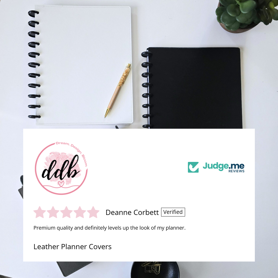 A styled flat-lay of disc bound planner covers and stationery on a white surface, with a large white review card overlay in the foreground showing a verified Google review for Deanne Corbett and the Judge.me Reviews logo.
