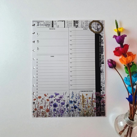 flatlay of Celestial Blooms discbound today planner inserts styled with vibrant rainbow palette accessories