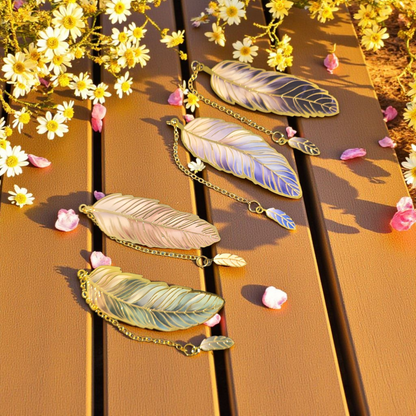 Gold feather planner bookmark by dream.design.bloom displayed out of packaging, elegant discbound accessory for planners and journals