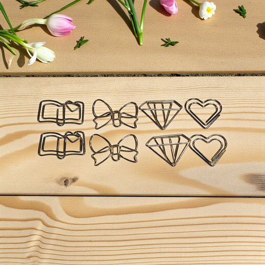 Gold paperclips by dream.design.bloom displayed with discbound planner, elegant stationery accessory for organised planning