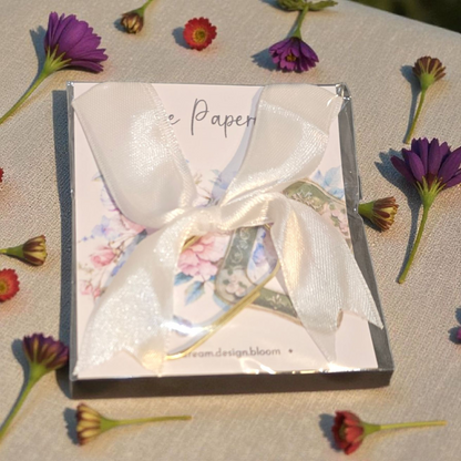 Packaged Large Paperclip with Bow by dream.design.bloom in Celestial Blooms palette, boutique discbound planner accessory for creative organisation
